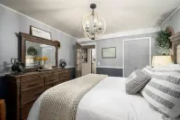 Cabin rental with Hot Tub, Fire Pit, mini fountain pond, hammocks, corn hole.