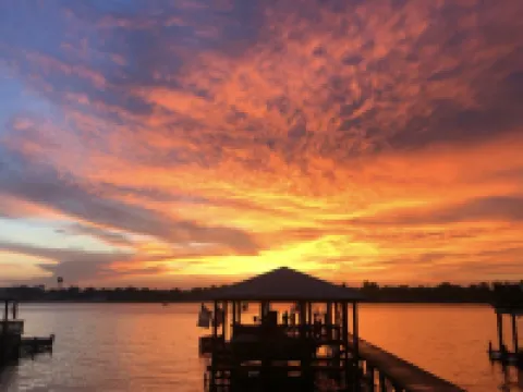 Screened porch and private pier on False River