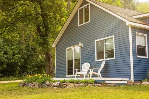 Spacious home near Torch Lake w/custom back patio, steps away from public access