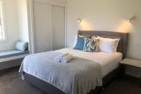Beach House with Bay of Fires views, featuring 2 bedrooms with ensuite bathrooms