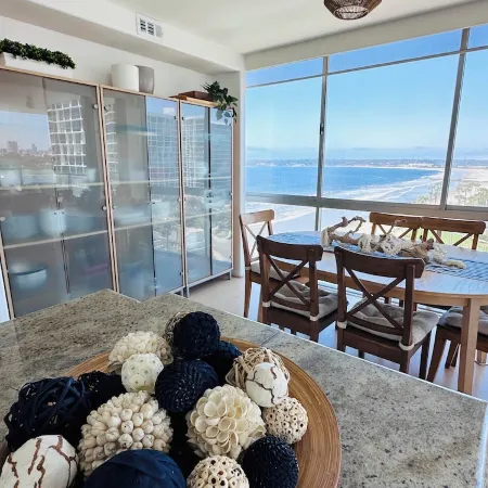 Beach and city views in condo with backyard access to beach and walkable town.