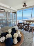 Beach and city views in condo with backyard access to beach and walkable town.
