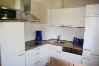 near the dyke (30m) and green beach, sea water swimming pool