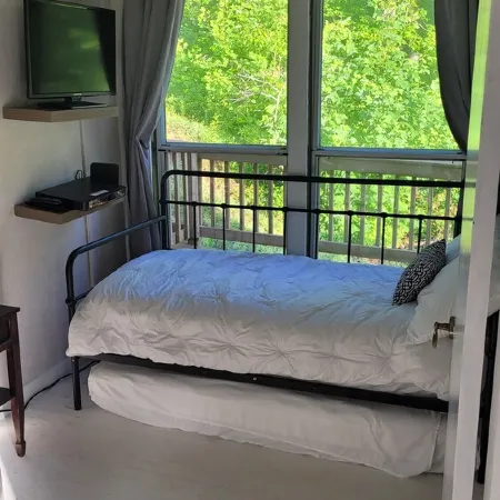 Cozy cool cabin in the mountains with a view Close to Downtown with a hot tub
