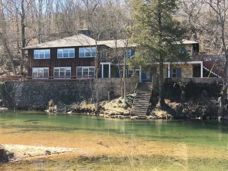 Historic Limestone House in park setting in Ozarks
