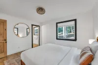 Hot Tub and Spacious Deck Amidst Pines - Stylish Tranquil Retreat