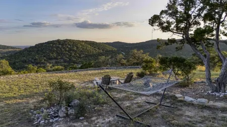 Escape to your private sanctuary nestled atop a serene hill with amazing views.