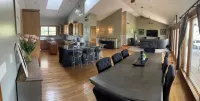Fully custom modern four bedroom home on 13 acres with a stocked pond.