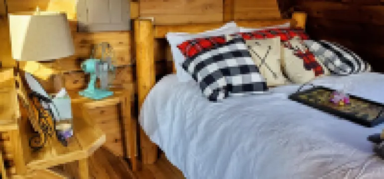 Private lakeside A-frame cabin w/ hot tub, beach, docks, games... 4 season fun!