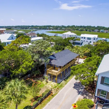 Classic Pawleys. Just Renovated. Long, breezy porches. Steps to beach and creek.