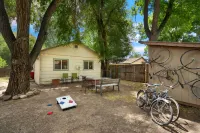 Fenced Backyard with Outdoor Seating and Bikes - Charming Vintage Escape
