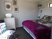Itzy Bitzy house is colourful, cosy, fully fenced with sea views