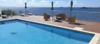 A true oceanfront villa with amazing sunsets and pool. Very nice location.