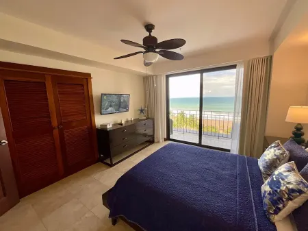 Breathtaking ocean views from every room in this 2-bedroom beachfront condo