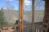 Cozy Pet Friendly Mountain Log Cabin in the Smokies with Deck and fire pit.