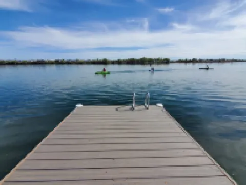 Spacious Lakehouse Getaway. Private Dock with large fenced Backyard and Gameroom