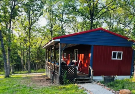 Cozy Cabin nestled on 10 acres just minutes from the lake and the speedway