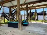 Modern Lakefront Treehouse with Pedal Boat, 2 Kayaks, Sun Deck and Arcade