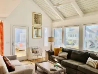 Walk to the beach or pool in this cozy villa. 2 deck spaces with 2 golf carts for enjoyment