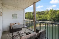 Access to Pools and Wet Bar Retreat - Charming Waterfront Haven