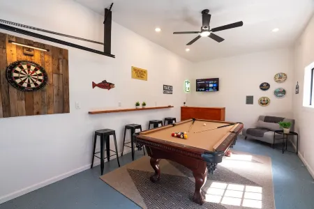 Charming Gated Retreat with Lakes, Pools, Private Sunroom & Game Room!