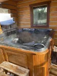 Log cabin with large deck and 6 person hot tub