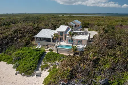Coral Loft 4BR + 1 BR Oceanfront Villa w/ Private Pool & Beach in Grand Cayman