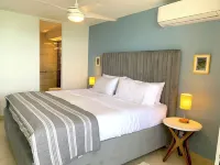 Beachfront Oceanview 2-suite condo with balcony, AC, WiFi, Pool, Fitness Room