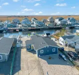 Beautifully updated waterfront home great for families & friends +beach badges.