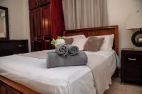 Prime Location + Rooftop Access + City Views + Queens Park Savannah + Walkable