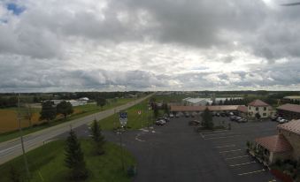 a view of a parking lot with cars and trees , taken from an elevated perspective at Country Inn Listowel