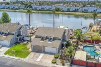 Waterfront modern home Sleeps 6 near Marina w/ Hot Tub, Large Deck, and EVCharge