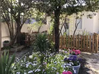 Small flowered house with private garden near town center