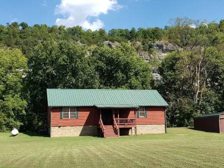 Beautiful cabin style home backing up on the White River!