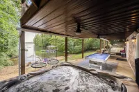 Lakefront Private Cove Retreat w/ Sandy Beach, Dock, Hot Tub + Boat & Ski Option