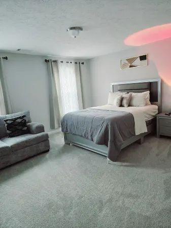 The Spacious Loft Apartment 3/2 Kingbed with Stairs, Pool and Grill Sleeps 7.