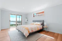 Retreat by the Sea – Coastal Escape with Cozy Spa & Panoramic Ocean Sunset Views