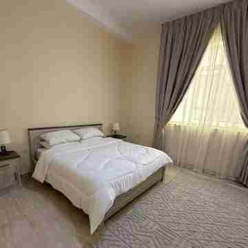 Spacious 4-bedroom apartment with WiFi, AC in terrific Shakhbout City Rooms