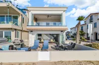 Located directly on the Sand. Two Master Suites, four bedrooms, four bathrooms.