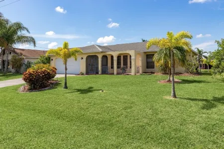 CAPE CORAL FLORIDA WATERFRONT WITH   HEATED POOL, PRIVATE DOCK