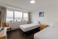 The Grand Hotel Hotels near Happy Valley Road Beach