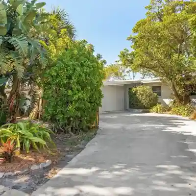 Private wooded 3BR/3BA house w/heated pool on canal just steps from beach Hotel Exterior