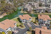 Balconies Overlooking Water and Golf Course - Cozy Beach Haven