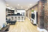 Spacious Open Kitchen and Exposed Brick - Stunning Urban Retreat