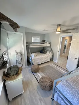 Relax here with beach views, steps to the beach, fenced in yard, pet friendly