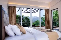 A 4 BHK VILLA WITH A PRIVATE INFINITY POOL SURROUDED BY SERENE HILLS