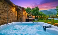 Scenic Riverfront Escape: Game Room, Fire Pit, King Bed - 4-Star
