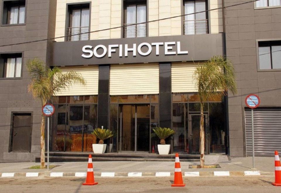 "a large hotel building with a sign that reads "" sofihotel "" prominently displayed on the front" at Sofi Hotel