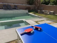 Resort_Pool_Spa with Mt Views-Arcade-Games at Desert Heath Hotels in Coachella