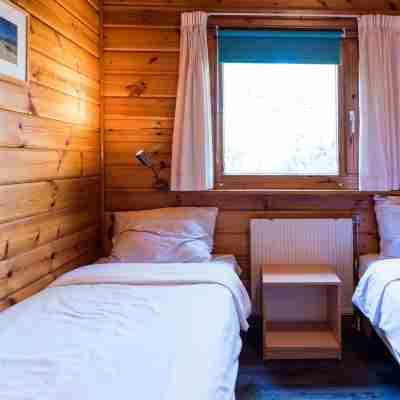 Wooden Bungalow with Dishwasher Near the Beach Rooms